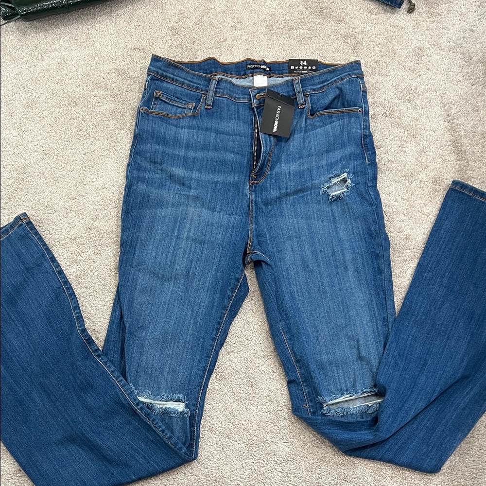 Brand new with tags. Tall super stretch flare jeans. Size 14..
